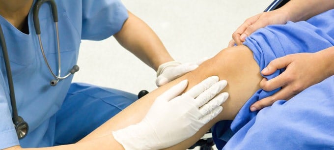 A person undergoing a knee examination