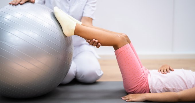 A child undergoing physiotherapy